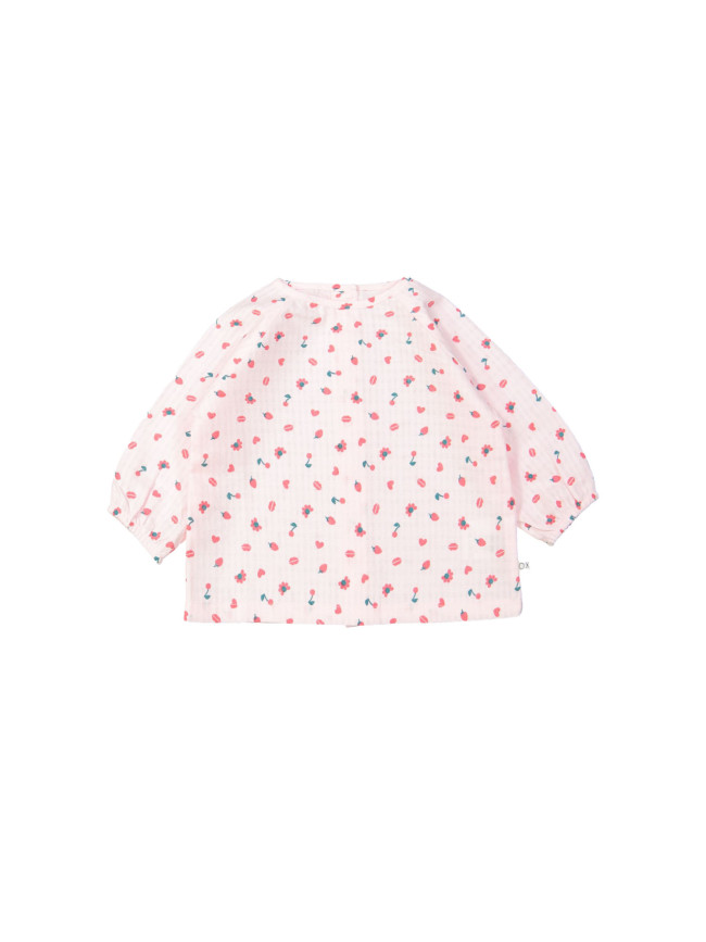 Blouse rouge objets rose clair