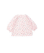 Blouse rouge objets rose clair