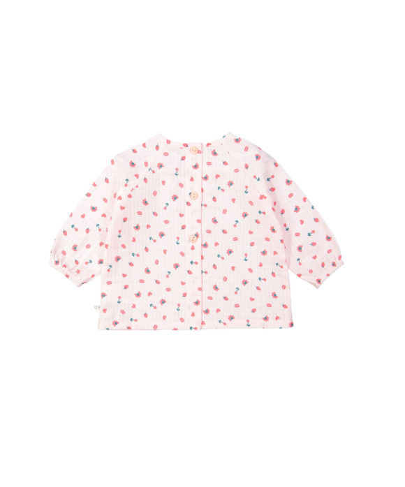 Blouse rouge objets rose clair