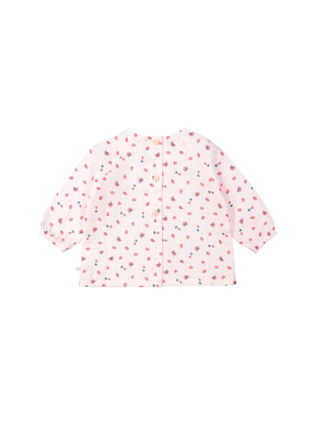 Blouse rouge objets rose clair