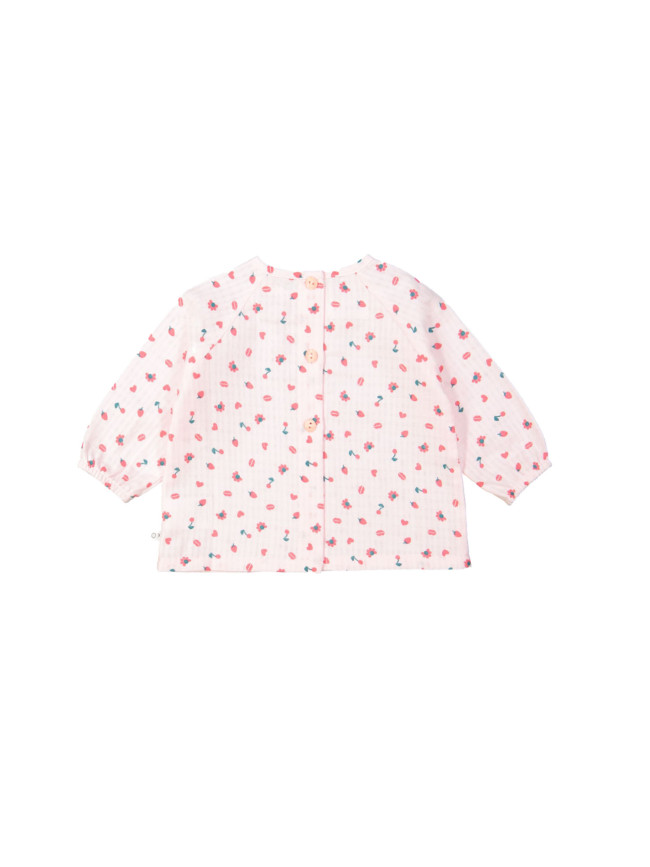 Blouse rouge objets rose clair