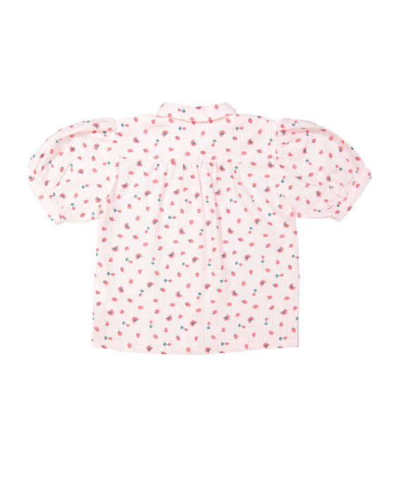 Blouse rouge objets rose clair